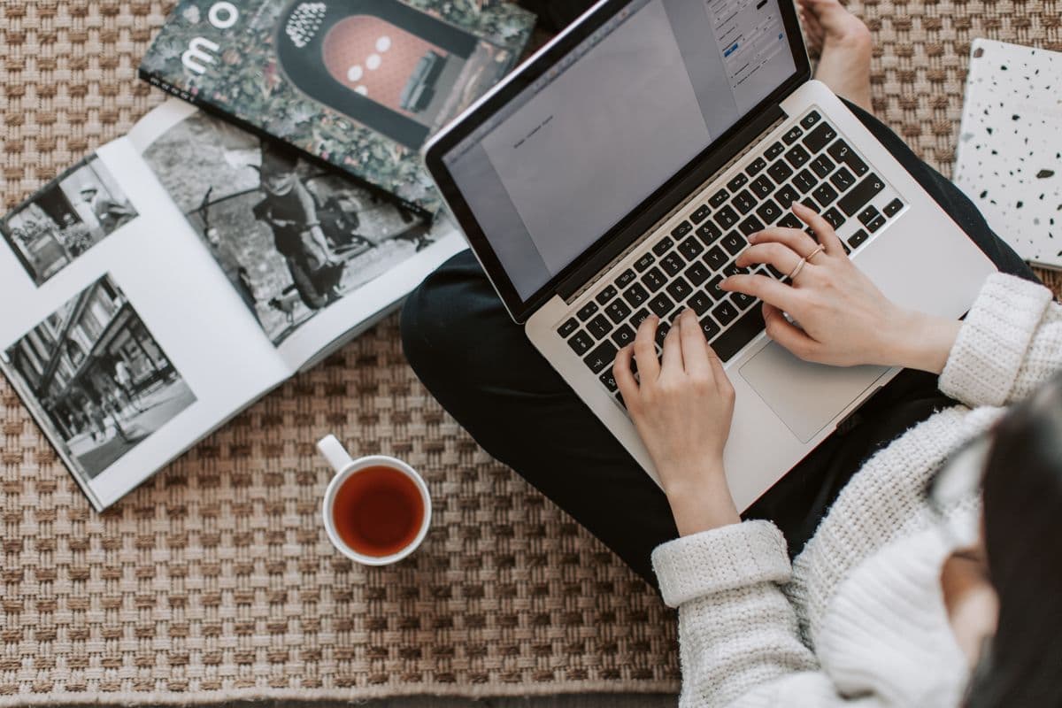 Laptop, tea, and magazines during a slow morning at home